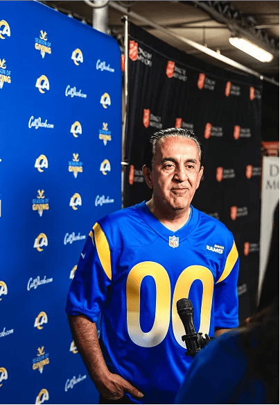 Jacob Emrani speaking at a Los Angeles Rams event