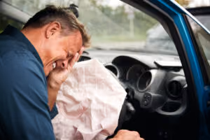 Deployed airbags inside a vehicle after a crash