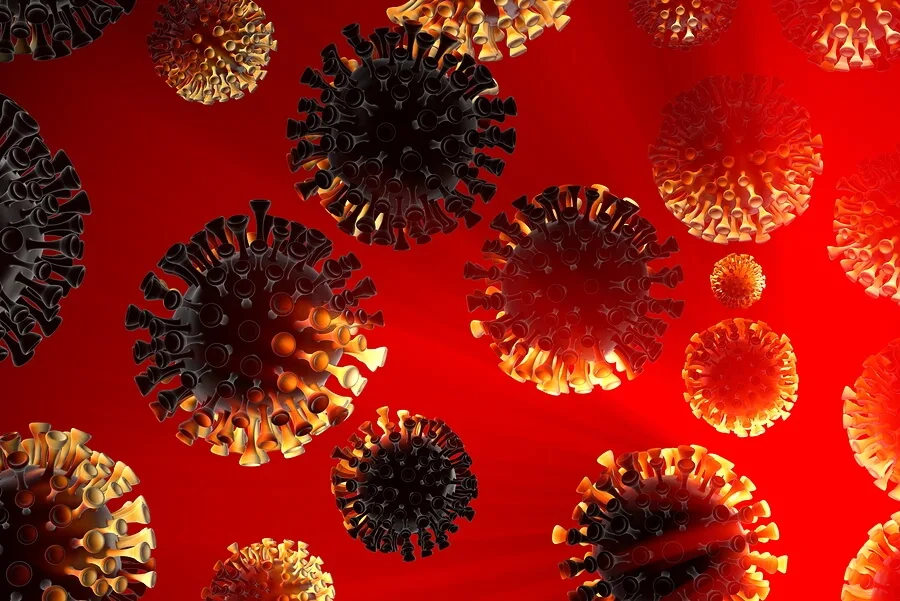 Illustration of multiple virus particles, resembling COVID-19, with spiky surfaces in black, orange, and red shades floating against a bright red background—symbolizing the invisible risks like personal injury after car accidents.