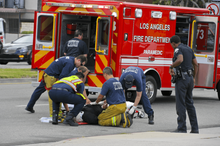 firemen helping injured victim