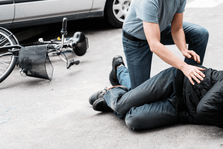 assisting bicycle accident victim on scene