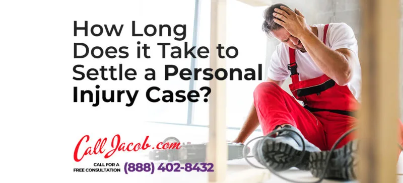 A man in red overalls sits with his head in his hand, looking stressed. Text reads: "How long does it take to settle a personal injury case? Call our car accident attorneys at Jacob.com (888) 402-8432 for a free consultation.