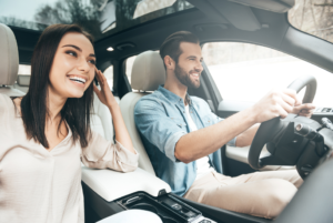 driving with smiling passenger