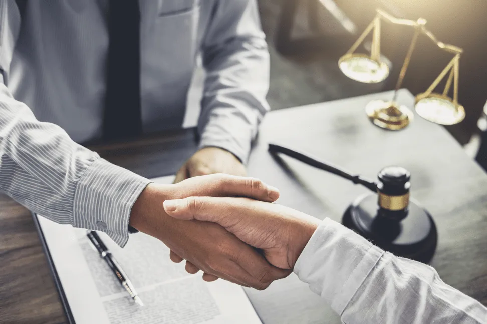 handshake over a gavel