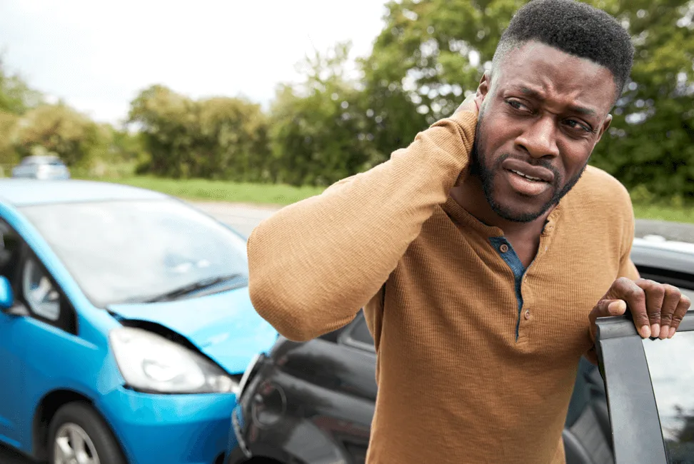 hurt-man-rubbing-neck-car-accident