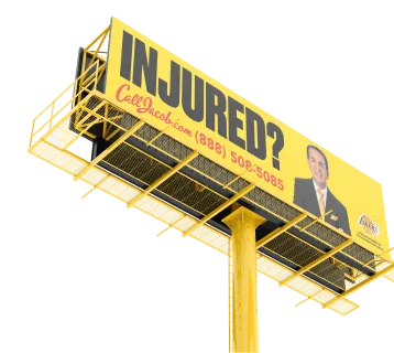 A yellow billboard reads “INJURED? CallJacob.com (888) 508-5085,” featuring a personal injury attorney in a suit with arms crossed on the right side.
