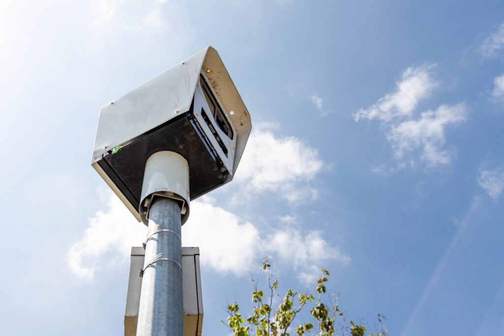 New California Traffic Laws in 2025. Close-up on speed trap surveillance camera along highway to control speeding to reduce speeding related accidents.