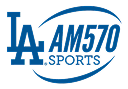 Blue "LA" logo next to text "AM570 SPORTS" with a curved line encircling the text, representing a sports radio station.