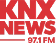 Red text logo that reads "KNX NEWS 97.1 FM" on a white background.