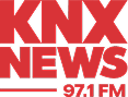 Red text logo that reads "KNX NEWS 97.1 FM" on a white background.