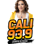 A woman with curly hair in a yellow hoodie stands behind bold text that reads "CALI 93.9" with "¡SIEMPRE DE FIESTA!" below it. The background is white.