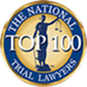 Circular gold and blue emblem with a statue of Lady Justice holding scales in the center. The text reads, "The National Top 100 Trial Lawyers.